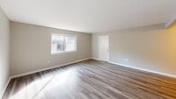 Located at 526 Richmond Hill Rd W in Augusta, Georgia, this single-floor home offers a clean, updated interior with a practical and straightforward layout. The living area features wood-look laminate flooring in a warm gray tone, neutral walls, and a large window that invites natural light, creating a bright and open atmosphere. A six-panel white door provides access to additional areas of the home, maintaining a cohesive design throughout.

The bedrooms are carpeted with plush, neutral-toned flooring and each includes a ceiling fan with a light fixture. Windows allow natural light to filter in, contributing to a comfortable and airy feel.

The kitchen is outfitted with white shaker-style cabinetry, light speckled countertops, stainless steel appliances including an electric range with overhead ventilation and a full-size refrigerator, and a single-basin stainless steel sink — offering a clean and functional workspace.

The bathroom features a full tub and shower combination with a white surround, brushed nickel fixtures, and wood-look flooring, providing a tidy and well-maintained space.

Throughout the home, consistent neutral tones, updated finishes, and ceiling fans in key rooms contribute to a move-in ready environment suited for comfortable everyday living.
