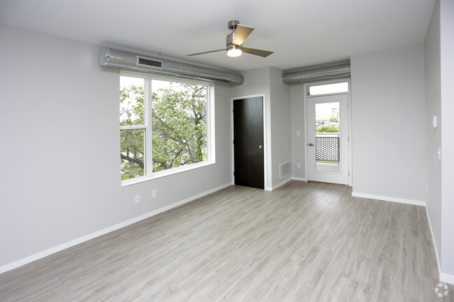 Spacious Living Room Area - Uptown Apartments