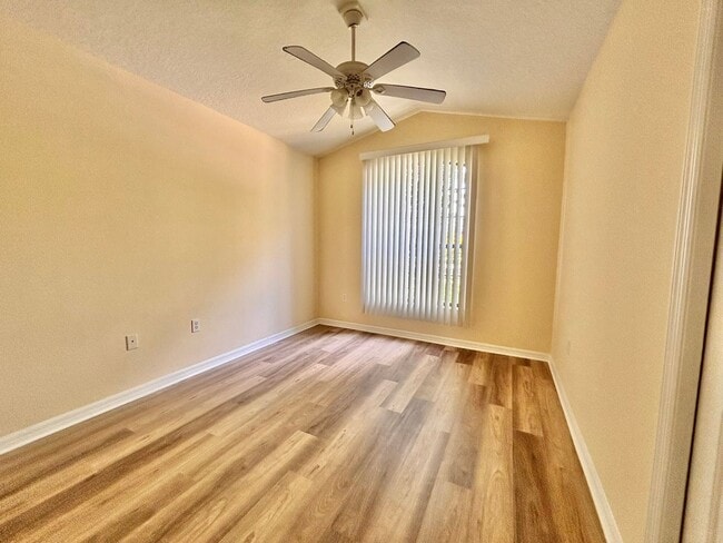 Building Photo - Large 4/2 with new floors in gated community!
