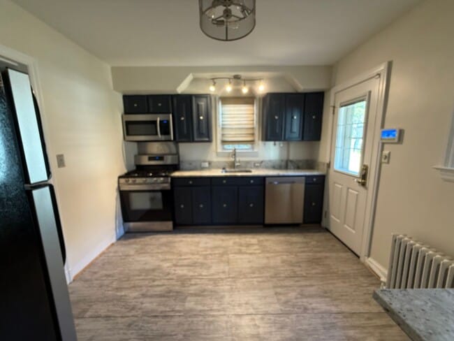 Building Photo - Discover comfort and convenience in charming North Michigan Park!