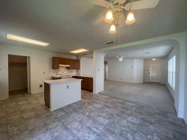 Building Photo - NICE 3 BEDROOM FEATURING AN ISLAND KITCHEN...