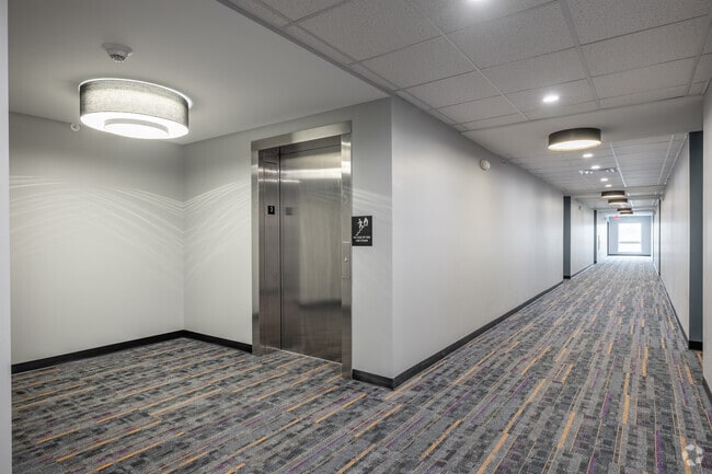 Hallway and Elevator - Brightdawn Village Apartments