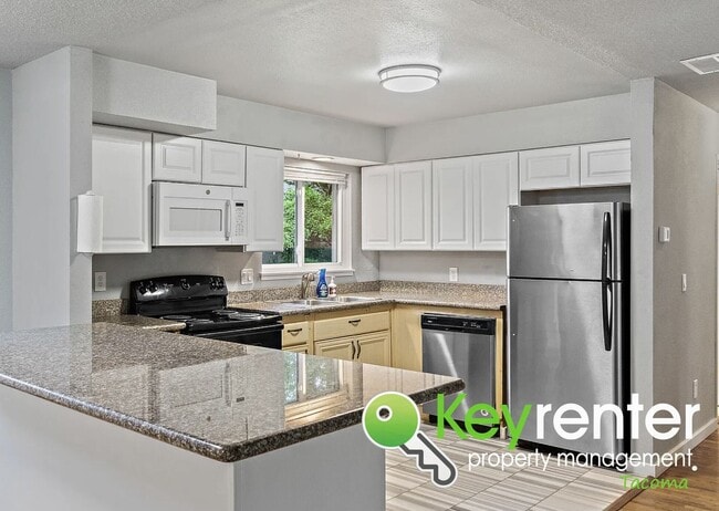 Foto del edificio - Updated 4-Bedroom, 2-Bath Tacoma Home for Rent Near Tacoma Community College and 6th Ave!