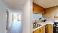 Located in Miami Lakes, FL, this well-appointed 2-bedroom, 2-bathroom residence offers a functional and comfortable single-floor layout. Light wood flooring runs throughout, complemented by neutral walls and textured ceilings, creating a clean and cohesive aesthetic.

The open living room is bright and spacious, flowing naturally into the kitchen, which features warm wood cabinetry, stainless steel appliances including a refrigerator and electric range, ample counter space, and a double sink — making it both practical and visually appealing.

Both bedrooms are generously proportioned, each offering built-in closets with bifold doors, light-filled windows with blinds, and the same consistent wood flooring found throughout the home. The primary bedroom provides a comfortable and private retreat.

The two bathrooms are clean and functional. One features a full tub-shower combination with white tile surround and a curtain rod, while the second offers a modern vanity with sleek cabinetry. A hallway connects the private areas of the home to the main living spaces. The overall ambiance is light, neutral, and move-in ready, ideal for comfortable everyday living.