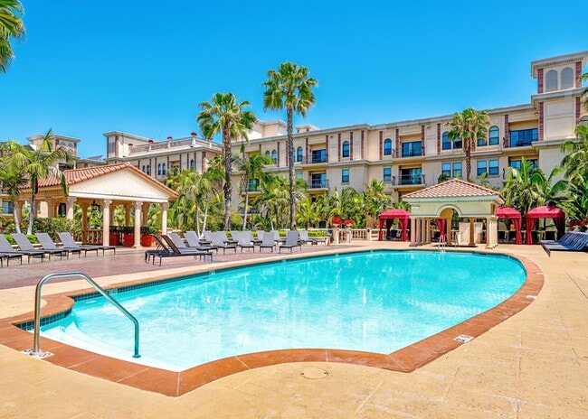 Pool Deck with Lounge Chairs and Cabanas - The Lorenzo