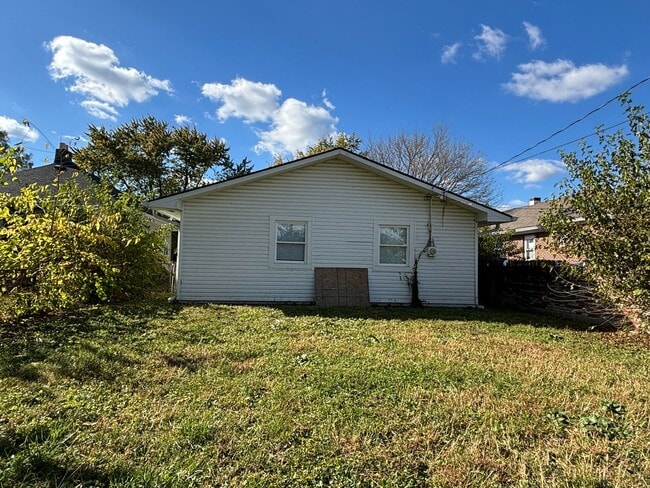 Photo - 4 Bed, 1.5 Bath Pet-Friendly Home with Fully Fenced Backyard