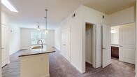 Located at 1405 Southwood Plantation Rd in Tallahassee, FL, this well-appointed one-bedroom, one-bathroom residence offers a functional and comfortable single-floor layout. The open-concept living and kitchen area seamlessly connects the two spaces, anchored by a peninsula with granite countertops and a double-basin sink. The kitchen is equipped with rich dark-wood cabinetry, stainless steel appliances including a refrigerator, electric range, and over-the-range microwave, as well as wood-look flooring that adds warmth and durability. A skylight above the kitchen brings in additional natural light, brightening the space throughout the day. Pendant lighting over the peninsula and a ceiling fan in the living area add to the functional design. The carpeted bedroom provides a quiet retreat, featuring a ceiling fan, a window with blinds offering greenery views, and a dedicated closet for ample storage. The full bathroom is generously sized, showcasing dark-wood vanity cabinetry with granite countertops, a single-basin sink, wood-look flooring, and a tub-shower combination set beneath a window that allows natural light to filter in. Throughout the residence, neutral tones and clean finishes create a bright, move-in-ready ambiance.
