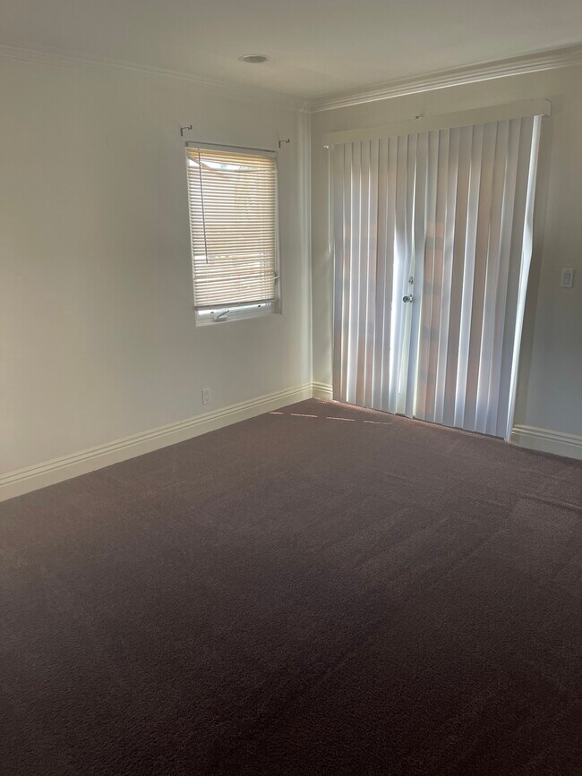 Master bedroom with balcony - 8461 S Halldale Ave