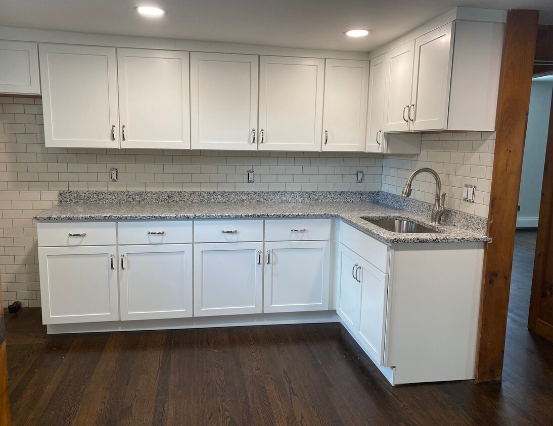 Kitchen. Shaker style cabinets, granite countertop, tile backsplash. New stainless steel appliances - 98 Broadway
