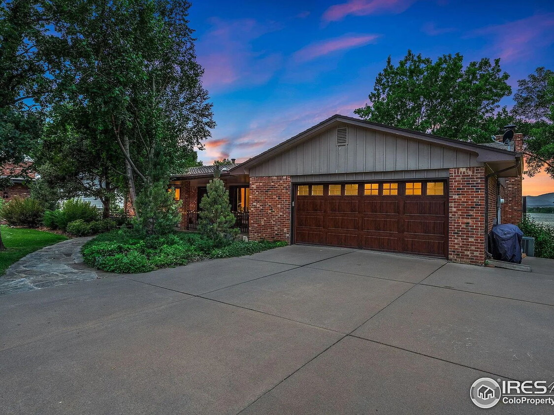 Building Photo - "Spacious 4-Bedroom Waterfront Haven with ...