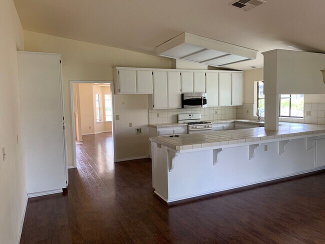 Building Photo - Just reduced! Well cared for home on the g...
