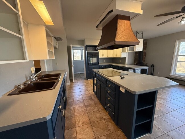 Building Photo - Spacious 4-Bedroom Home with Sunroom & Fenced Backyard