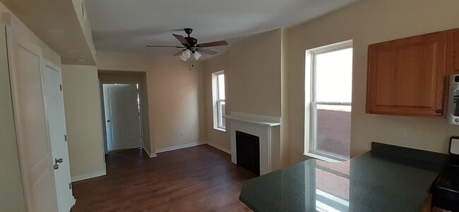 view of living/dining room from kitchen - 7718 Brashear St Apartments