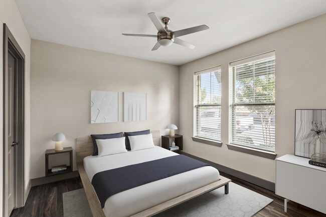 Experience serene comfort in this stylish, sunlit bedroom. - The Sawyer at One Bellevue Place