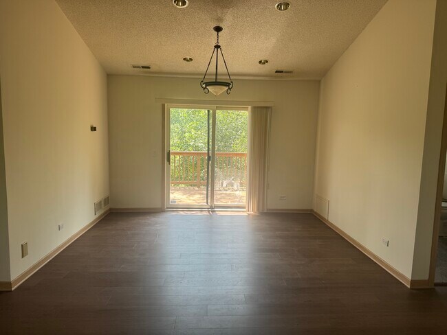 Dining Room with Patio Door access to 400 square foot balcony - 109 E Sanctuary Dr