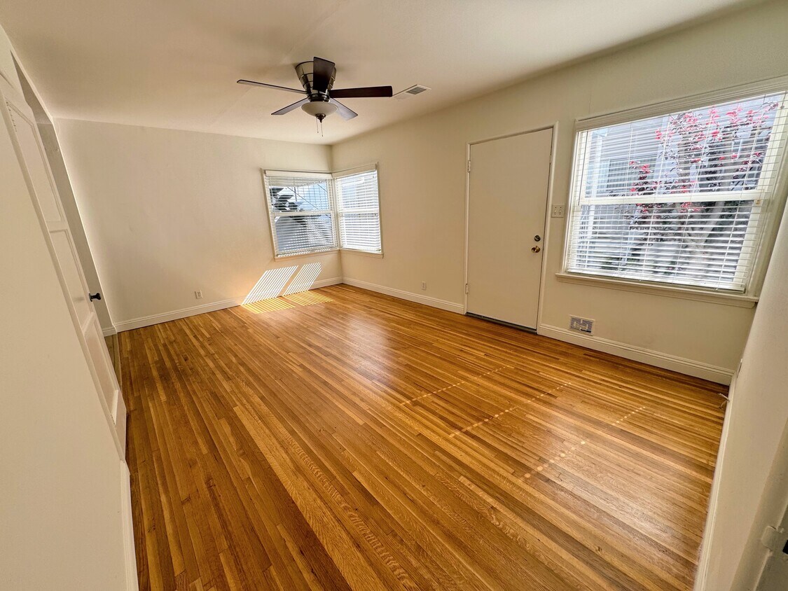 Living room - front door also opens to a retractable screen door for additional light and air - 839 21st St