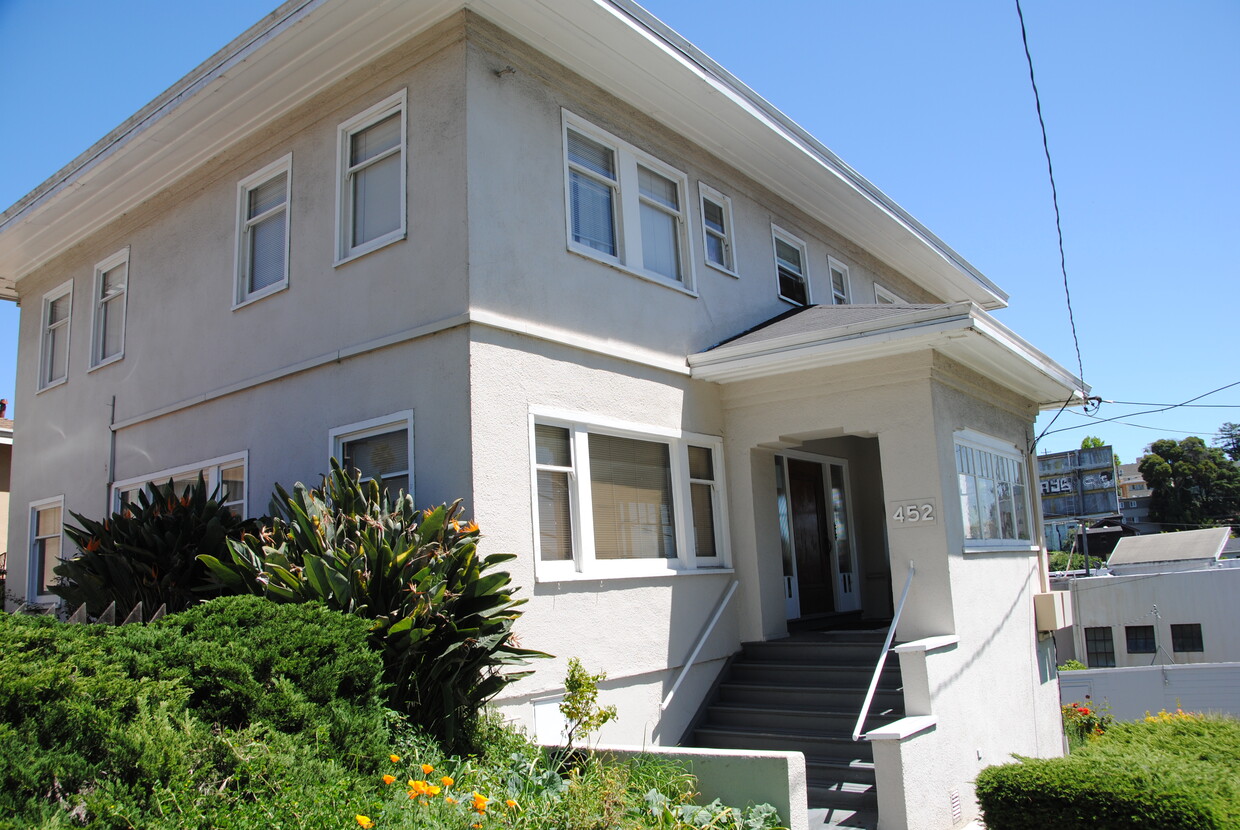 Front of building with garden space. - 452 Elwood Ave