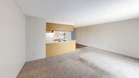 This 540 square foot apartment in Wichita, Kansas, offers a well-designed living space on a single floor. The open-concept layout seamlessly integrates the living room and kitchen, creating a spacious feel. The kitchen features honey-colored wood cabinets, white appliances, and a functional galley layout with a breakfast bar. Warm wood-tone flooring in the kitchen contrasts with plush carpeting in the living areas and bedroom, adding comfort and style.

The bedroom, measuring 120 square feet, includes a built-in closet with sliding doors, providing ample storage. A large window allows natural light to brighten the space. The bathroom, while compact, offers a full-sized bathtub with a shower.

Throughout the apartment, textured ceilings and neutral-toned walls create a clean, modern aesthetic. Strategically placed lighting fixtures, including a decorative ceiling light in the bedroom, ensure well-lit spaces. A sliding glass door in the living area leads to an outdoor space, extending the living area and providing additional natural light.

This efficiently designed apartment maximizes its 540 square feet, offering a comfortable and functional living space ideal for singles or couples.