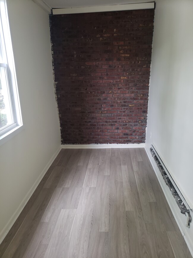 Bonus Room with Natural Brick Wall(Partial View) - 151 W Englewood Ave