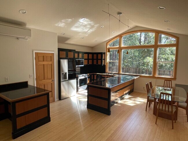 Open concept kitchen and dining area - 160 Glenlyn Dr