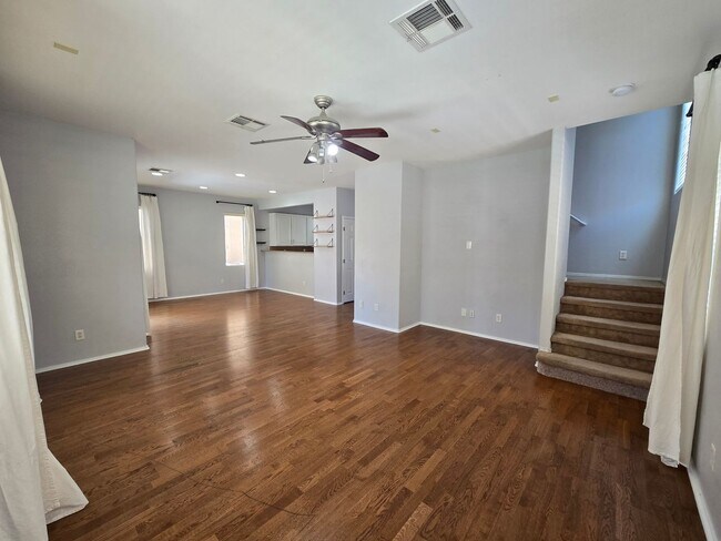 Building Photo - Step outside to a spacious, larger-than-average Las Vegas backyard complete with lush artificial ...