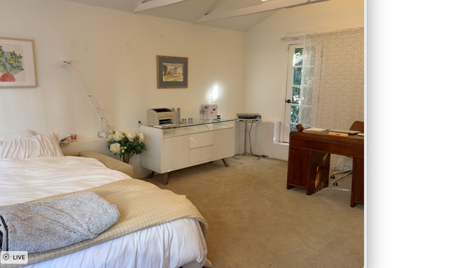 Studio layout with bed, desk, french doors on both sides - 2026 N Oxford Ave