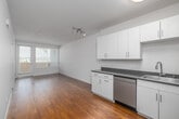 Located at 417 Centinela Ave in Inglewood, CA, this well-designed one-bedroom, one-bathroom unit offers a clean, modern aesthetic throughout. Warm hardwood flooring flows continuously across the entire space, complementing the bright white walls and creating a cohesive, welcoming atmosphere.

The open-concept kitchen and living area serves as the heart of the unit. The kitchen is equipped with stainless steel appliances — including a refrigerator, range, microwave, and dishwasher — alongside white shaker-style cabinetry, dark countertops, and a sink. Track lighting and flush-mount ceiling fixtures ensure the area is well-lit.

The bedroom is a comfortable, well-proportioned retreat featuring a large window that invites natural light and provides outdoor views. Multiple closets throughout the unit offer generous storage options. A hallway connects the main living spaces to the bathroom, which features a full tub-shower combination with clean white tile surround.

Additional highlights include a private patio accessible from the living area through a glazed door with sidelight, an in-unit laundry area, and a practical layout that maximizes every square foot. The overall design is clean and contemporary, making this an efficient and livable space in a convenient Inglewood location.