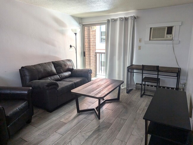 Building Photo - High Rise Living Directly Across the Street from Campus!