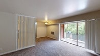 Located at 404 Tunnel Blvd in Chattanooga, Tennessee, this single-story, two-bedroom, one-bathroom home offers a straightforward and functional layout across a comfortable footprint. The kitchen is well-equipped with an abundance of warm oak cabinetry — both upper and lower — providing ample storage space. It features light countertops, a stainless steel refrigerator, a black gas range, a single-basin sink, and durable tile flooring with a classic diamond pattern, creating a practical and efficient cooking space. Both bedrooms are carpeted in a neutral tone and bathed in natural light from windows that overlook lush, green surroundings. The spacious primary bedroom includes an open closet with a built-in shelf and rod, offering convenient storage. The second bedroom also features its own closet and receives plentiful natural light. The bathroom carries a retro character, distinguished by light blue tile work accenting the tub surround and walls, a white soaking tub, and a mirrored medicine cabinet. Neutral-toned walls throughout the home provide a clean, move-in-ready canvas. The overall ambiance is practical and comfortable, with greenery visible from the bedroom windows lending a peaceful, natural feel to the living environment.