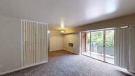 Located at 404 Tunnel Blvd in Chattanooga, Tennessee, this single-story, two-bedroom, one-bathroom home offers a straightforward and functional layout across a comfortable footprint. The kitchen is well-equipped with an abundance of warm oak cabinetry — both upper and lower — providing ample storage space. It features light countertops, a stainless steel refrigerator, a black gas range, a single-basin sink, and durable tile flooring with a classic diamond pattern, creating a practical and efficient cooking space. Both bedrooms are carpeted in a neutral tone and bathed in natural light from windows that overlook lush, green surroundings. The spacious primary bedroom includes an open closet with a built-in shelf and rod, offering convenient storage. The second bedroom also features its own closet and receives plentiful natural light. The bathroom carries a retro character, distinguished by light blue tile work accenting the tub surround and walls, a white soaking tub, and a mirrored medicine cabinet. Neutral-toned walls throughout the home provide a clean, move-in-ready canvas. The overall ambiance is practical and comfortable, with greenery visible from the bedroom windows lending a peaceful, natural feel to the living environment.