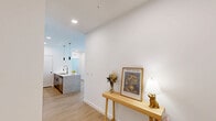 Located at 4130 High Mountain Rd NE in Huntsville, Alabama, this well-designed two-bedroom, two-bathroom residence offers a clean, contemporary aesthetic across a single floor. Light wood-style flooring flows throughout, complementing the bright white walls and creating a cohesive, modern feel.

The open-concept kitchen and living area serves as the heart of the home. The kitchen is outfitted with stainless steel appliances, a two-tone cabinet scheme featuring white uppers and darker lower cabinets, light blue subway tile backsplash, and a granite-topped island with pendant lighting — ideal for both cooking and casual dining. The living room is filled with natural light from large windows, and includes a ceiling fan overhead.

Both bedrooms are well-proportioned, with the primary bedroom offering generous space, a ceiling fan, and wide windows that invite ample natural light. The second bedroom is bright and clean with its own window outlook.

The two bathrooms reflect the same modern design language, featuring dark-hardware accents, wood-toned cabinetry, light flooring, and clean white finishes. One bathroom includes a shower-tub combination, while the second provides a more open layout with additional storage cabinetry. Hallways connect the spaces efficiently, and a dedicated closet adds practical storage.