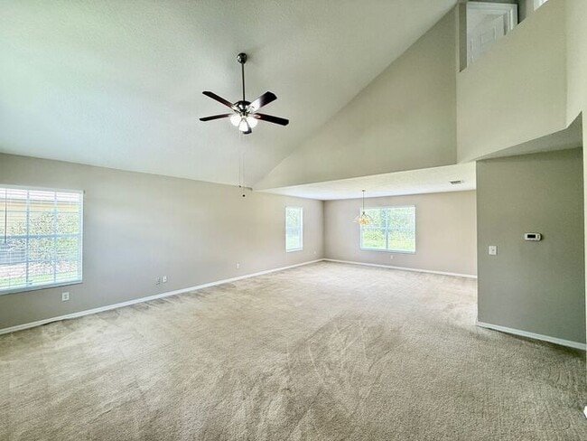 Building Photo - LARGE AND SPACIOUS 4/3 HOME IN EAST ORLANDO WEDGEFIED COMMUNITY