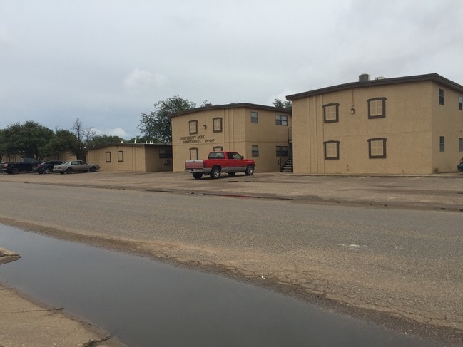 New Exterior Paint/Stucco New Parking Paving - University Park Apartments
