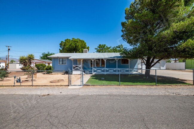 Building Photo - LARGE FENCED YARD WITH DETACHED GARAGE