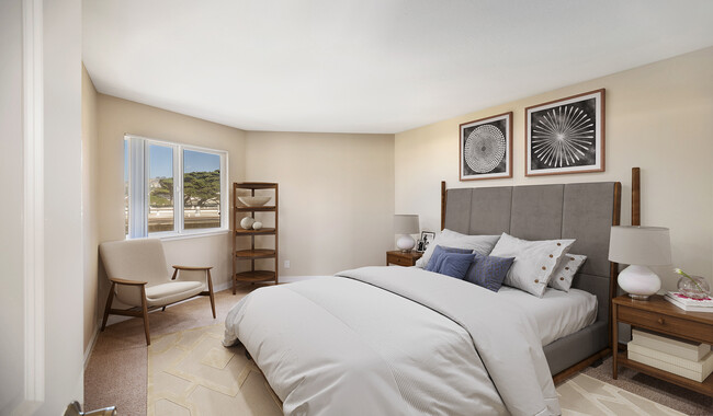 Master bedroom with great view and plenty on natural light - The Bluffs at Pacifica Apartments