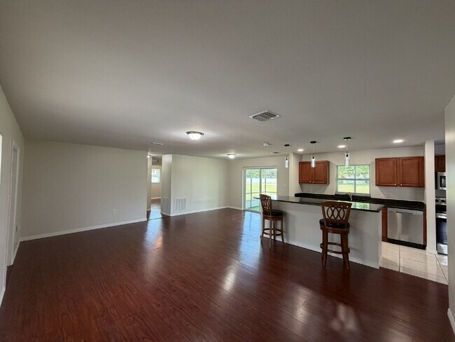 Building Photo - "Charming 3-Bedroom Home with Gleaming Hardwood Floors!"