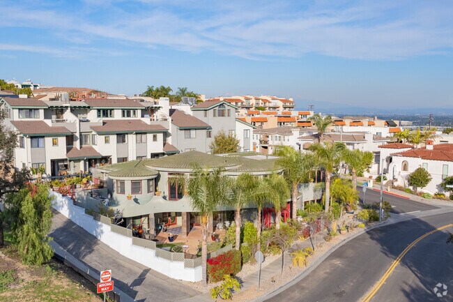 A unique home sits on its own corner of the street in Signal Hill.