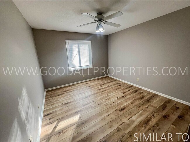 Building Photo - Ground-level condo featuring 2 bedrooms and 1 full bathroom, along with a detached garage.