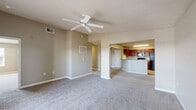 Located at 2201 Orem Dr in Houston, TX, this well-appointed 2-bedroom, 2-bathroom home offers a thoughtfully designed single-floor layout with a generous amount of living space. The open-concept living and dining area features soft carpeting, neutral warm-toned walls, and a ceiling fan, creating a comfortable and airy atmosphere. The kitchen is equipped with rich wood cabinetry, granite-style countertops, a black refrigerator, and a range, all finished with easy-care hard flooring. A dedicated dining area flows naturally from the kitchen for convenient everyday living. Both bedrooms are carpeted and offer ceiling fans and ample closet space, with the primary bedroom featuring a ceiling fan with lighting and a double-door closet. Sliding glass doors in one bedroom lead to a private balcony, bringing in abundant natural light and outdoor views. The two bathrooms each include a soaking tub with tiled surround and shower — one features warm wood-toned cabinetry with hard flooring. A dedicated in-unit laundry room with washer and dryer hookups adds everyday convenience. Five closets throughout the home provide exceptional storage. A utility room and hallway complete this functional and welcoming floor plan.