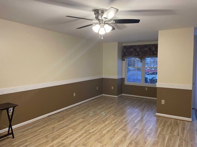 Building Photo - Spacious 3BR Townhome with Walkout Basement, Deck, Fenced Yard, Central A/C + Assigned Parking