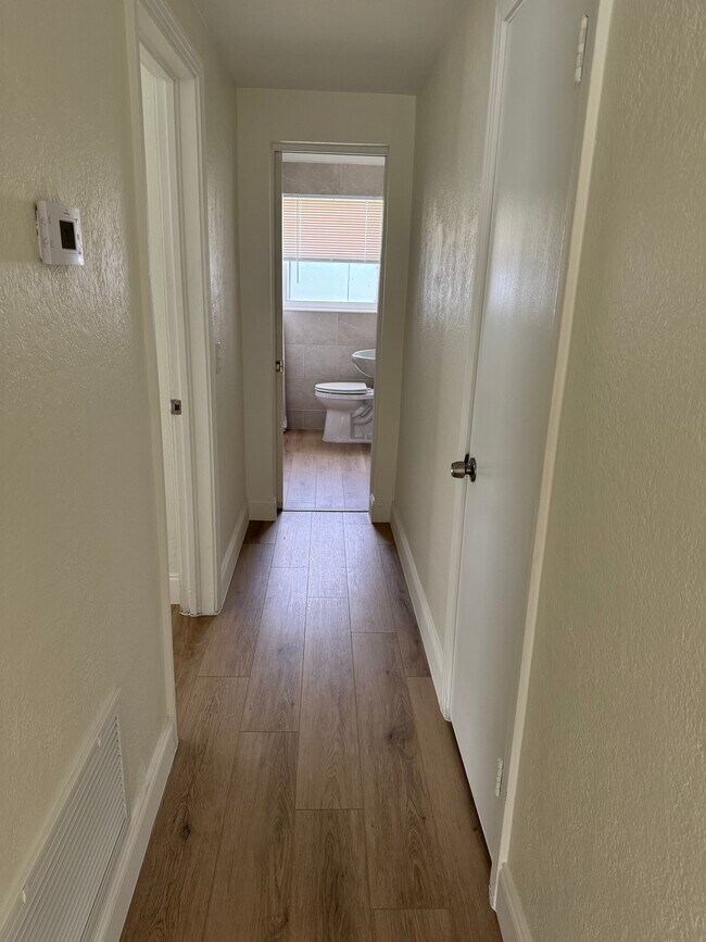 Hall leading to bedroom and bathroom - 1675 Drew St
