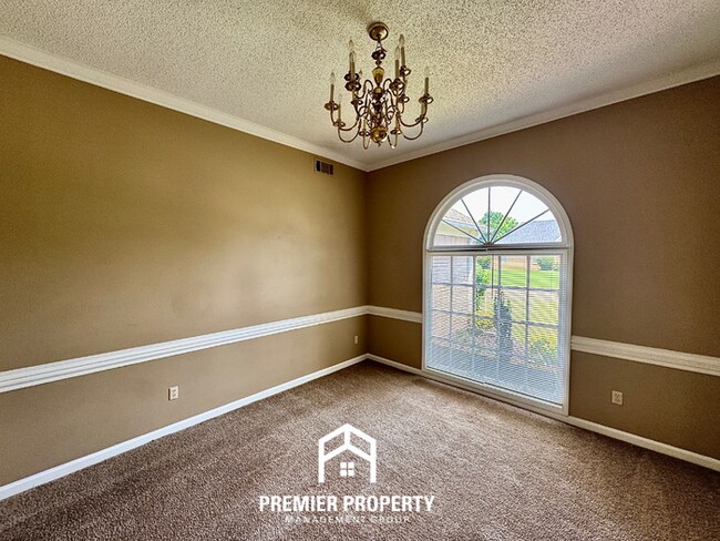 Building Photo - Spacious 3BR/2BA Near Southwind | 1,958 Sq Ft, Brick Fireplace, 2-Car Garage & Quiet Cove