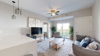 Located at 5711 Menerey Ln in Columbus, OH, this well-appointed 2-bedroom, 2-bathroom residence offers a thoughtfully designed single-floor layout. The open-concept kitchen and living area serves as the heart of the home, featuring light wood-look flooring throughout, a ceiling fan, and a sliding glass door that floods the space with natural light and leads to a private patio. The kitchen is outfitted with two-tone cabinetry — crisp white upper cabinets paired with dark lower cabinets — white quartz countertops, a textured tile backsplash, stainless steel appliances including a dishwasher, and pendant lighting above the peninsula. The living area provides a comfortable, open atmosphere with direct patio views. The primary bedroom is a generously sized retreat with a tray ceiling detail and a natural light window. The second bedroom offers comparable comfort with ample space. Four closets, including walk-in storage with wire shelving, provide excellent organization throughout. Both bathrooms are finished with white vanities, quartz countertops, and wood-look flooring. A dedicated laundry area and utility room add everyday convenience, completing this modern and functional Columbus residence.