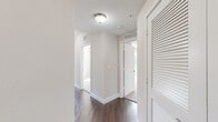 Located in Pembroke Pines, FL, this single-floor unit offers four bedrooms and two bathrooms with a well-designed, functional layout. Dark hardwood flooring flows throughout the main living areas and hallways, lending warmth and continuity to the space. The open kitchen and dining area serves as the heart of the home, featuring white shaker cabinetry, granite countertops, a curved kitchen island with pendant lighting, and a full suite of stainless steel appliances including a side-by-side refrigerator, range, microwave, and dishwasher. A glass door brings in natural light, enhancing the kitchen's bright, airy feel. The living and dining area is generously proportioned, with multiple windows, a ceiling fan, and abundant natural light creating a welcoming atmosphere. Each of the four bedrooms is finished with plush carpeting, neutral walls, and windows with views of lush Florida greenery. The spacious primary bedroom offers ample room to accommodate full-size furnishings. The two bathrooms are finished with large-format tile flooring and white subway tile surrounds. The primary bath features both a glass-enclosed walk-in shower and a soaking tub, while the second bath offers a tub-shower combination with granite vanity countertops. Hallways connect all rooms efficiently, completing a practical and comfortable floor plan.