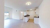 Located in the Koreatown neighborhood of Los Angeles, this 2-bedroom, 2-bathroom unit offers a well-organized and efficiently designed floor plan with light wood flooring throughout. The open-concept living and dining area flows naturally into the kitchen, which features white cabinetry, dark countertops, a gas range, and a peninsula with a sink — providing both functionality and a sense of openness. A hallway connects the main living spaces to the private areas of the unit.

Both bedrooms are bright and well-proportioned, with large windows that invite natural light and sliding doors leading to private balconies offering outdoor views of the surrounding neighborhood. Each bedroom includes a sliding-door closet, with additional closet storage available throughout the unit — four closets in total. The primary bedroom is a comfortable size with its own access to a balcony.

The two bathrooms are clean and practical, each featuring a tub-shower combination with sliding glass doors, and one includes a vanity with a dark countertop and white cabinetry. The overall aesthetic of the unit is bright and neutral, with white walls and light flooring creating a clean, airy ambiance throughout.