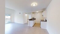 Located in the Koreatown neighborhood of Los Angeles, this 2-bedroom, 2-bathroom unit offers a well-organized and efficiently designed floor plan with light wood flooring throughout. The open-concept living and dining area flows naturally into the kitchen, which features white cabinetry, dark countertops, a gas range, and a peninsula with a sink — providing both functionality and a sense of openness. A hallway connects the main living spaces to the private areas of the unit.

Both bedrooms are bright and well-proportioned, with large windows that invite natural light and sliding doors leading to private balconies offering outdoor views of the surrounding neighborhood. Each bedroom includes a sliding-door closet, with additional closet storage available throughout the unit — four closets in total. The primary bedroom is a comfortable size with its own access to a balcony.

The two bathrooms are clean and practical, each featuring a tub-shower combination with sliding glass doors, and one includes a vanity with a dark countertop and white cabinetry. The overall aesthetic of the unit is bright and neutral, with white walls and light flooring creating a clean, airy ambiance throughout.