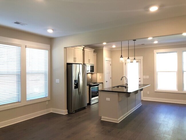 Building Photo - Brand New END UNIT North of Main St  3 mil...