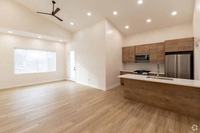 Large living space with 14 ft ceilings.Door leads to roof top deck. - 4774 Bancroft St