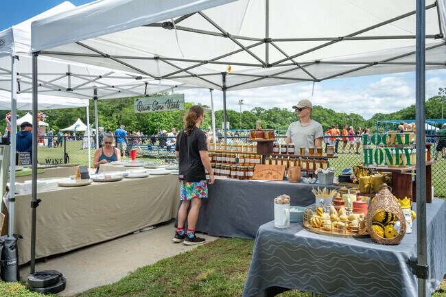 Vendors sell their wares at Rhythm on the River.