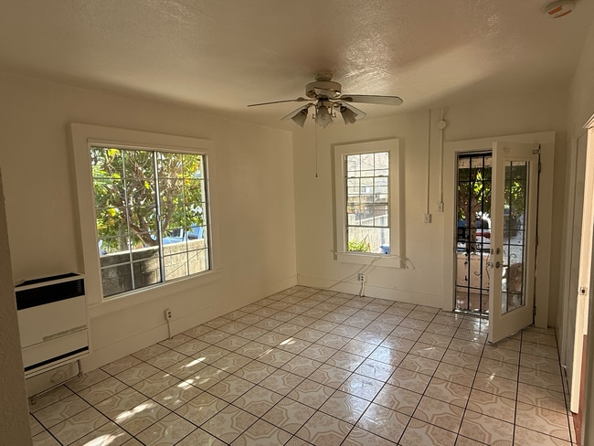 living room with beautiful lighting - 1216 Fedora St
